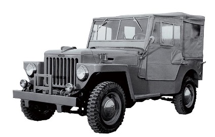 1951 Toyota BJ, the original Land Cruiser model, shown in black and white with military-style canvas top and rugged off-road tires
